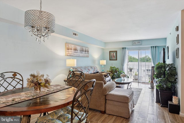 649 Brandon Rd, Eagleville, PA 19403 - living room featuring a chandelier and wood finished floors