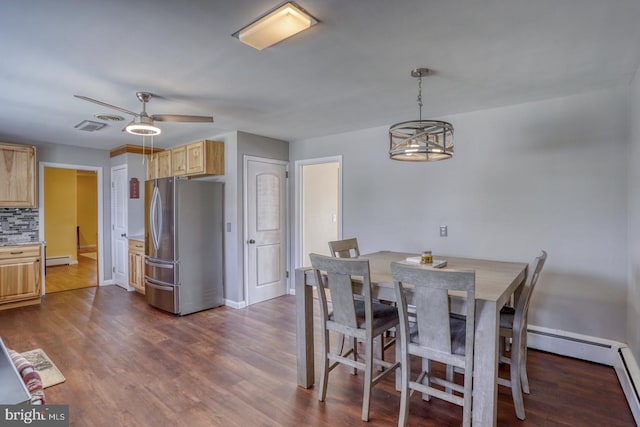 333 S School Ln, Smyrna, DE 19977 - dining space with dark wood finished floors, ceiling fan, and baseboards