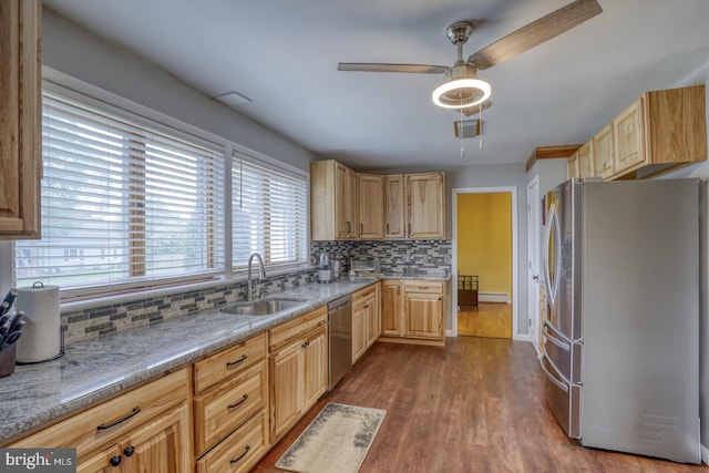 333 S School Ln, Smyrna, DE 19977 - kitchen featuring stainless steel appliances, a sink, light brown cabinets, and backsplash