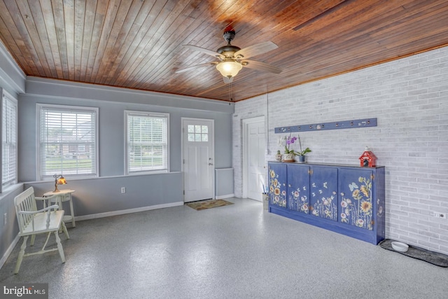 333 S School Ln, Smyrna, DE 19977 - entryway with wood ceiling, baseboards, brick wall, and a ceiling fan