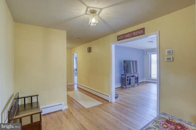 333 S School Ln, Smyrna, DE 19977 - hall featuring a baseboard heating unit, wood finished floors, and baseboards