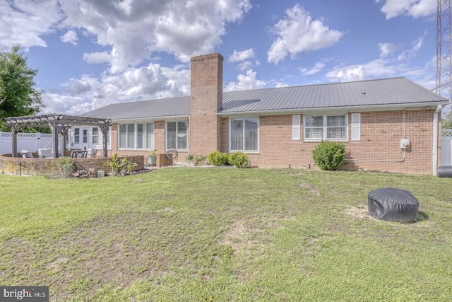 333 S School Ln, Smyrna, DE 19977 - back of property with a pergola, metal roof, brick siding, and a chimney