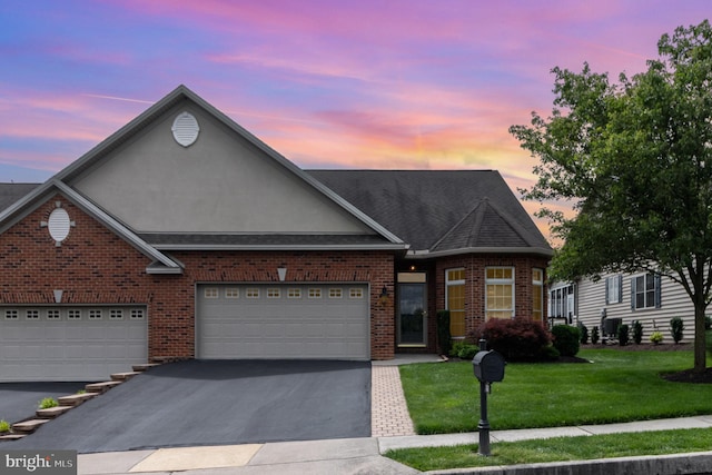 1430 Amherst Ct, Mechanicsburg, PA 17050 - traditional-style home featuring driveway, brick siding, a front lawn, a garage, and stucco siding