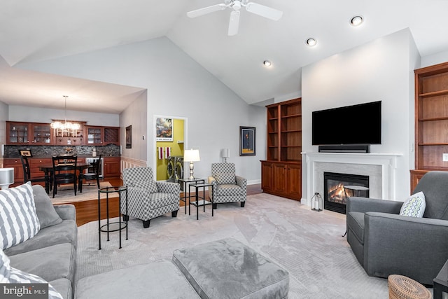 1430 Amherst Ct, Mechanicsburg, PA 17050 - living room featuring a chandelier, a glass covered fireplace, a ceiling fan, high vaulted ceiling, and recessed lighting
