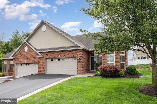 1430 Amherst Ct, Mechanicsburg, PA 17050 - view of front of home featuring brick siding, asphalt driveway, stucco siding, and an attached garage