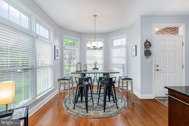 1430 Amherst Ct, Mechanicsburg, PA 17050 - dining area featuring a chandelier, baseboards, and wood finished floors