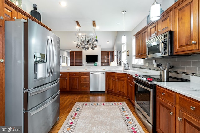 1430 Amherst Ct, Mechanicsburg, PA 17050 - kitchen with stainless steel appliances, dark wood-type flooring, brown cabinets, open floor plan, and a sink