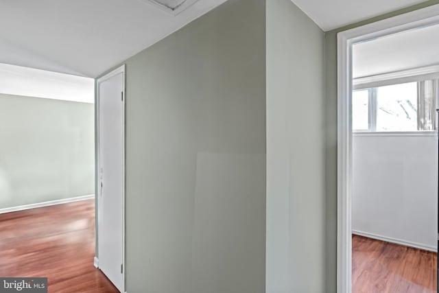 9615 51st Pl, College Park, MD 20740 - hall featuring lofted ceiling, wood finished floors, and baseboards