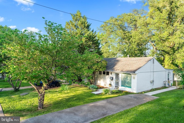 9615 51st Pl, College Park, MD 20740 - view of front facade featuring a front yard and roof with shingles