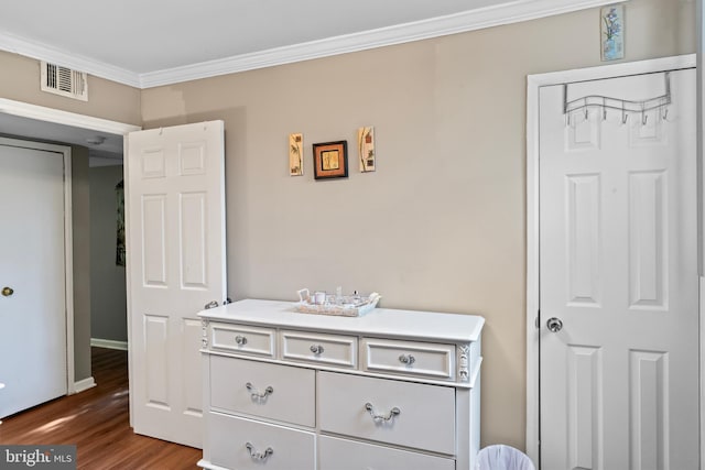 9615 51st Pl, College Park, MD 20740 - bedroom with ornamental molding, dark wood-style flooring, and baseboards