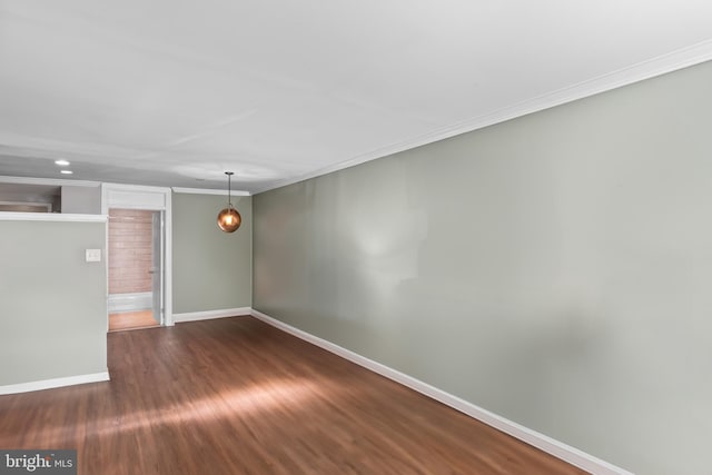 9615 51st Pl, College Park, MD 20740 - unfurnished room featuring baseboards, crown molding, and dark wood-style floors