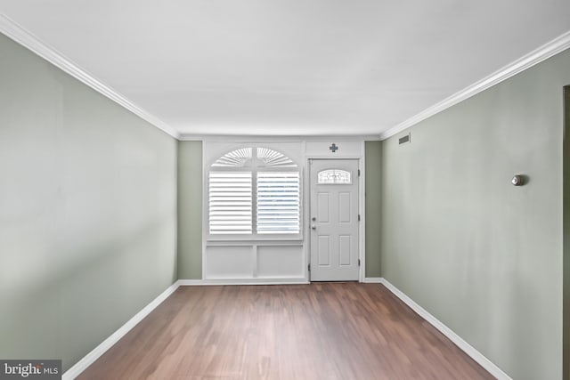 9615 51st Pl, College Park, MD 20740 - entryway featuring baseboards, wood finished floors, and crown molding