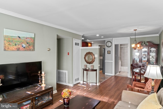 9615 51st Pl, College Park, MD 20740 - living room with ornamental molding, a chandelier, wood finished floors, baseboards, and recessed lighting