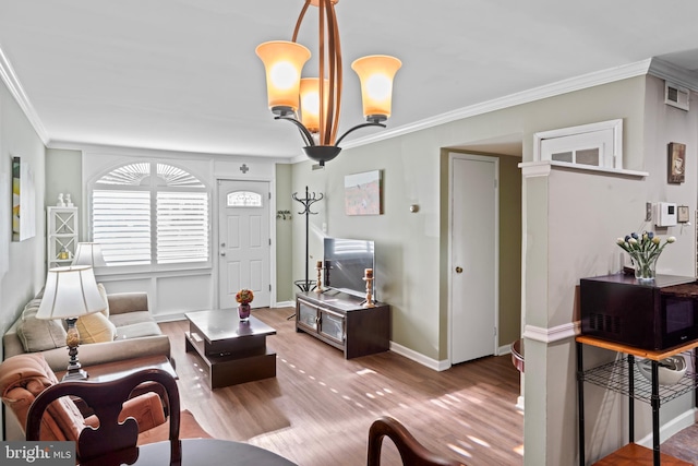 9615 51st Pl, College Park, MD 20740 - living room with crown molding, a chandelier, wood finished floors, and baseboards