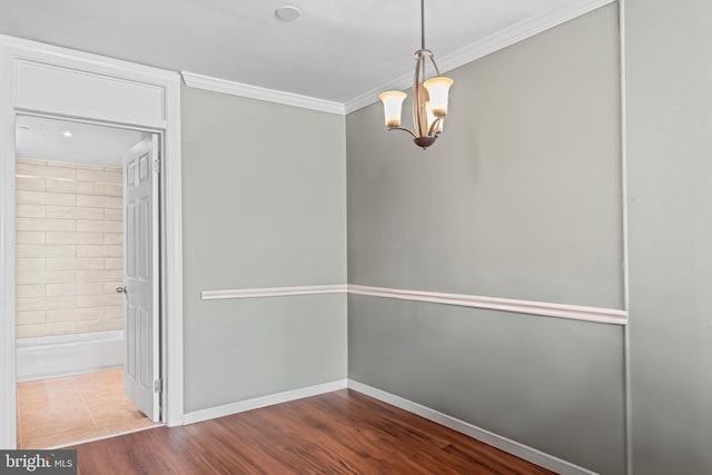 9615 51st Pl, College Park, MD 20740 - spare room featuring a chandelier, ornamental molding, wood finished floors, and baseboards