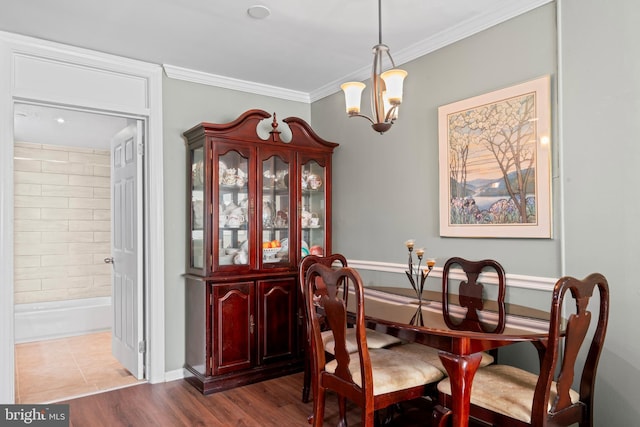 9615 51st Pl, College Park, MD 20740 - dining space featuring a chandelier, crown molding, and wood finished floors