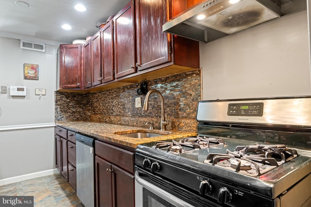 9615 51st Pl, College Park, MD 20740 - kitchen with stainless steel appliances, a sink, wall chimney exhaust hood, baseboards, and decorative backsplash