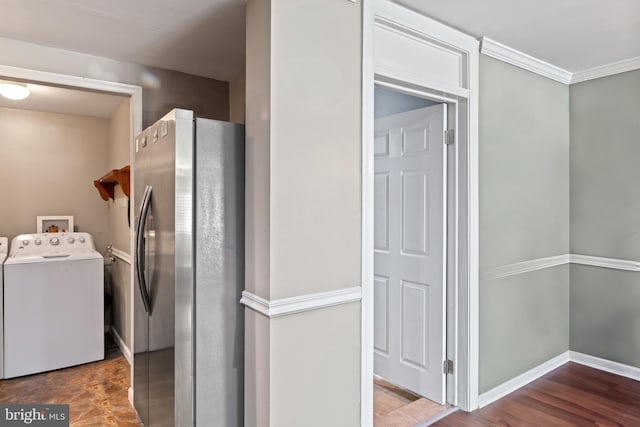 9615 51st Pl, College Park, MD 20740 - laundry room with ornamental molding, washer and clothes dryer, and baseboards