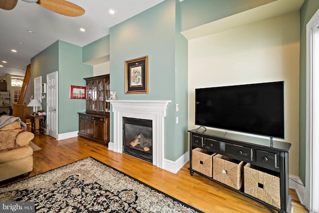 1812 Fairmount Ave, Philadelphia, PA 19130 - living area featuring wood finished floors, a glass covered fireplace, a ceiling fan, and recessed lighting