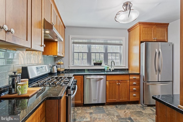 20 Oberlin Ave, Swarthmore, PA 19081 - kitchen featuring stainless steel appliances, under cabinet range hood, a sink, and brown cabinetry