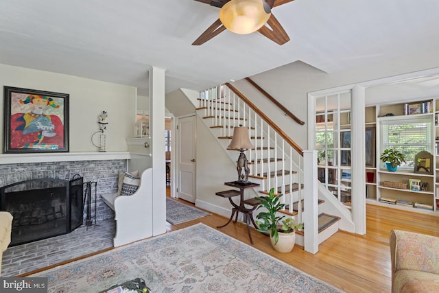 20 Oberlin Ave, Swarthmore, PA 19081 - living area featuring stairs, ceiling fan, wood finished floors, and a fireplace
