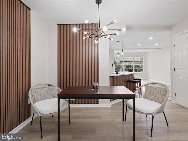 14282 Newbern Loop, Gainesville, VA 20155 - dining area featuring light wood-style floors, a chandelier, recessed lighting, and baseboards
