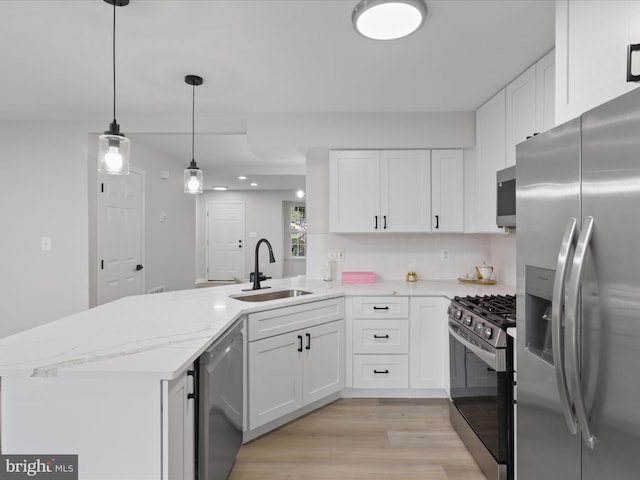 14282 Newbern Loop, Gainesville, VA 20155 - kitchen with stainless steel appliances, a sink, a peninsula, and white cabinetry