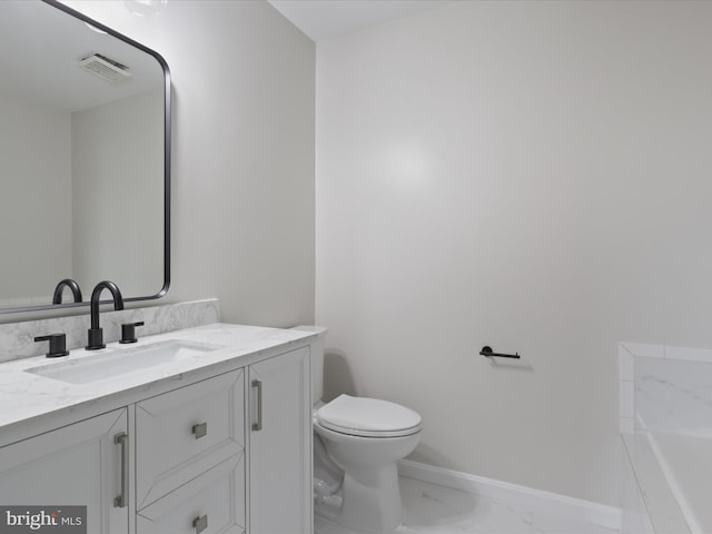 14282 Newbern Loop, Gainesville, VA 20155 - bathroom with marble look tiles, toilet, vanity, baseboards, and a bath