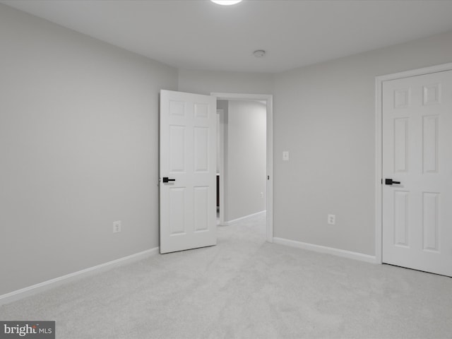 14282 Newbern Loop, Gainesville, VA 20155 - unfurnished bedroom featuring light colored carpet and baseboards