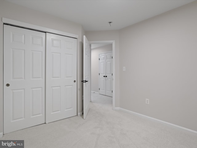 14282 Newbern Loop, Gainesville, VA 20155 - unfurnished bedroom with light carpet, baseboards, and a closet