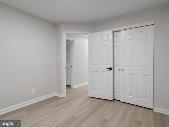 14282 Newbern Loop, Gainesville, VA 20155 - unfurnished bedroom with light wood-style flooring, baseboards, and a closet