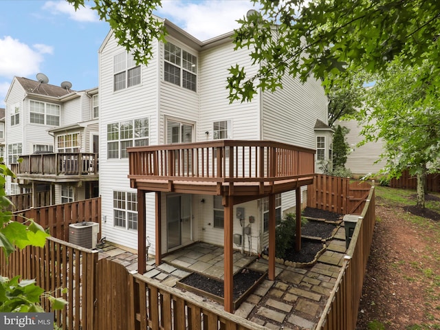 14282 Newbern Loop, Gainesville, VA 20155 - back of property with cooling unit, a fenced backyard, a wooden deck, and a patio area