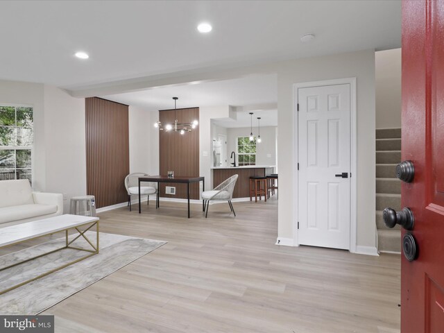 14282 Newbern Loop, Gainesville, VA 20155 - living room featuring light wood-style flooring, plenty of natural light, recessed lighting, a chandelier, and stairway