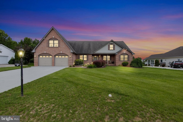 25 Warm Breeze Ct, Hanover, PA 17331 - traditional home with brick siding, concrete driveway, a front yard, covered porch, and a shingled roof