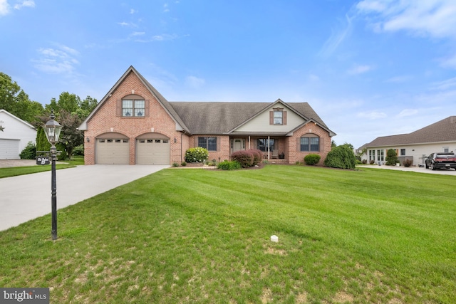 25 Warm Breeze Ct, Hanover, PA 17331 - traditional home featuring brick siding, driveway, a front lawn, and a garage