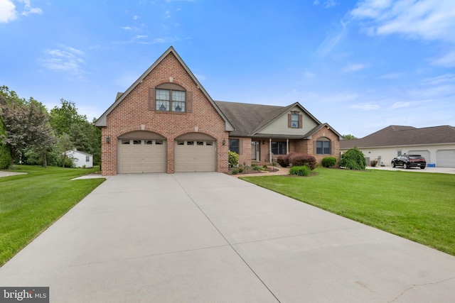 25 Warm Breeze Ct, Hanover, PA 17331 - view of front of house with brick siding, a front lawn, concrete driveway, and an attached garage