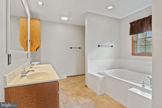 25 Warm Breeze Ct, Hanover, PA 17331 - full bath with a bath, double vanity, recessed lighting, and baseboards