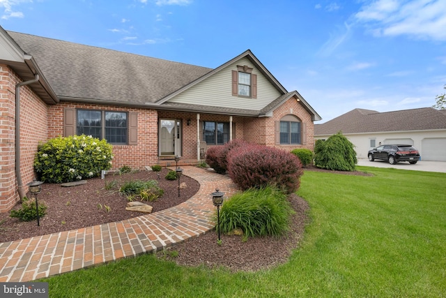 25 Warm Breeze Ct, Hanover, PA 17331 - traditional home with brick siding, a front yard, and a shingled roof