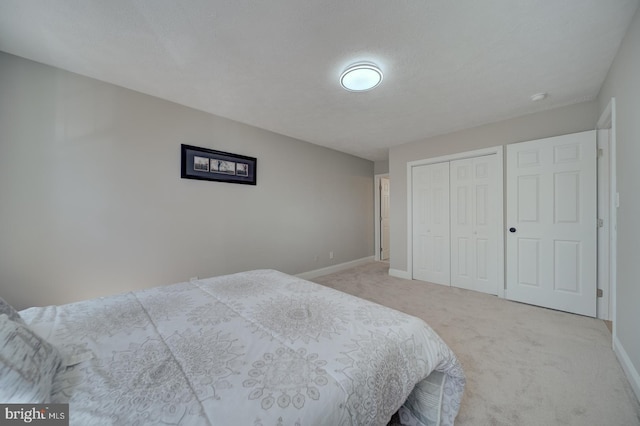 8250 Doewood Rd, Lusby, MD 20657 - bedroom featuring light carpet, baseboards, and a closet