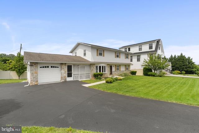 559 Schenely Ave, King Of Prussia, PA 19406 - view of front of home featuring stone siding, an attached garage, and driveway