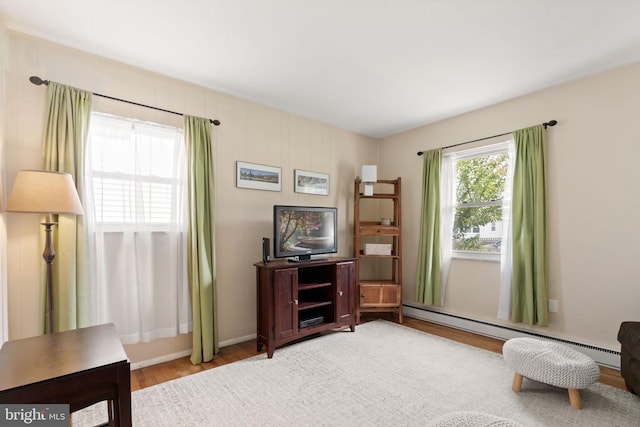 559 Schenely Ave, King Of Prussia, PA 19406 - living area featuring wood finished floors and a baseboard heating unit