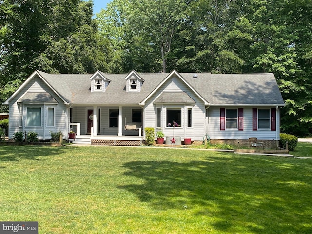 2119 Saint Heather Ln, Gambrills, MD 21054 - new england style home with covered porch, a front lawn, and roof with shingles