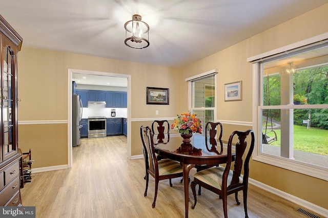 2119 Saint Heather Ln, Gambrills, MD 21054 - dining room with light wood finished floors and baseboards