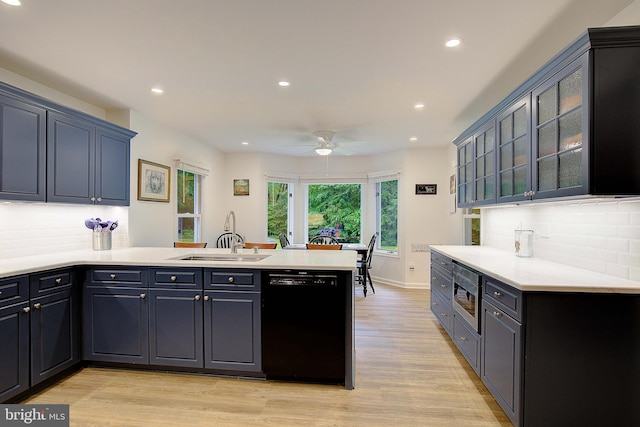 2119 Saint Heather Ln, Gambrills, MD 21054 - kitchen featuring dishwasher, a sink, a peninsula, stainless steel microwave, and light wood finished floors