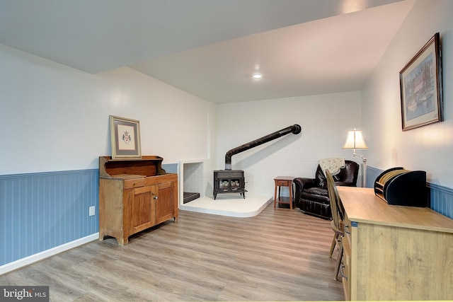 2119 Saint Heather Ln, Gambrills, MD 21054 - office area with a wood stove, light wood-style flooring, and wainscoting