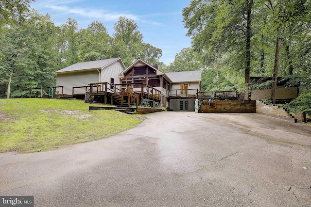 2119 Saint Heather Ln, Gambrills, MD 21054 - view of front of home featuring a wooden deck, stairs, asphalt driveway, and a front yard