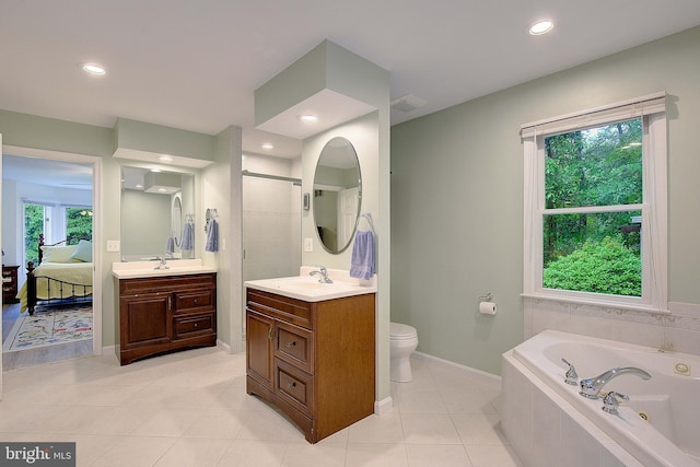 2119 Saint Heather Ln, Gambrills, MD 21054 - ensuite bathroom with a jetted tub, vanity, tile patterned flooring, baseboards, and a walk in shower