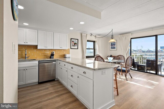 3801 Atlantic Ave Unit 517, Ocean City, MD 21842 - kitchen featuring dishwasher, a sink, light wood-style floors, a peninsula, and recessed lighting