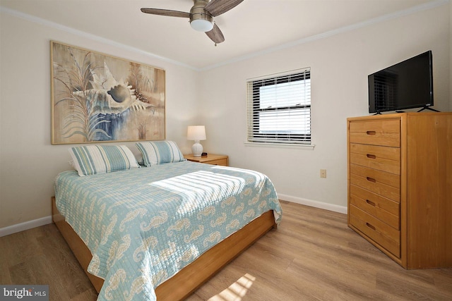 3801 Atlantic Ave Unit 517, Ocean City, MD 21842 - bedroom featuring baseboards, crown molding, light wood finished floors, and a ceiling fan