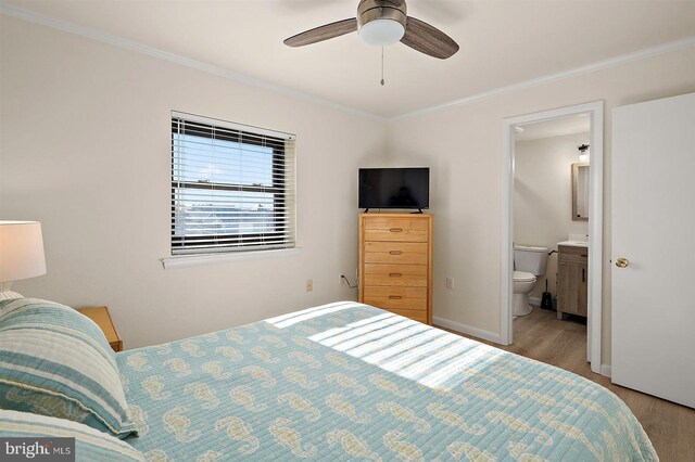 3801 Atlantic Ave Unit 517, Ocean City, MD 21842 - bedroom with wood finished floors, ornamental molding, ensuite bath, baseboards, and a ceiling fan